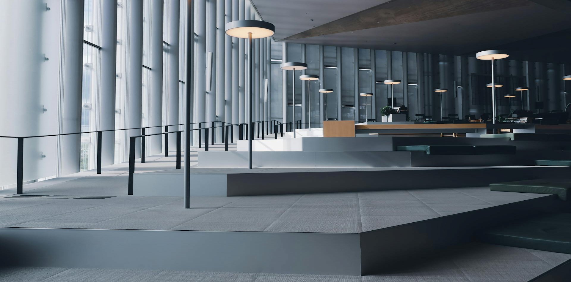 Modern institutional interior with clean geometric lines and natural daylight, conveying stability, discretion, and strategic authority